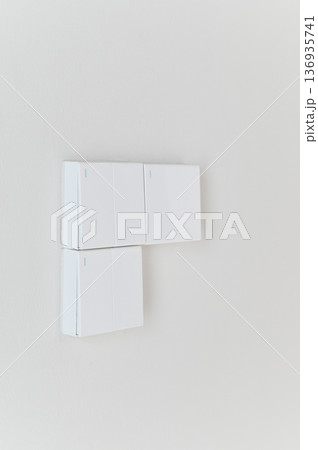 Minimalist white light switch on clean white wall modern interior simple design home automation contemporary style bright uncluttered vertical composition copy space Minimalist white light switch on clean white wall modern interior simple design home automation contemporary style bright uncluttered vertical composition copy space 136935741