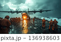 Military transport aircraft landing on aircraft carrier in stormy weather 136938603
