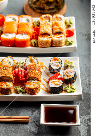 Assorted sushi rolls set with soy sauce 136939942