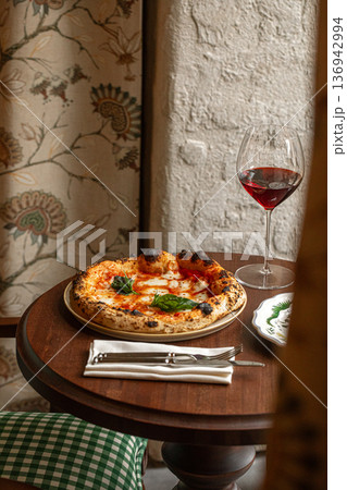 Margherita pizza with basil and red wine Margherita pizza with basil and red wine 136942994