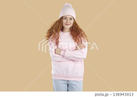 Portrait of stylish teenage girl in trendy autumn casual clothes isolated on beige background. Portrait of stylish teenage girl in trendy autumn casual clothes isolated on beige background. 136943013