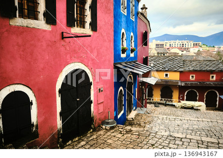 Colorful Historic Buildings Along Cobblestone Street 136943167