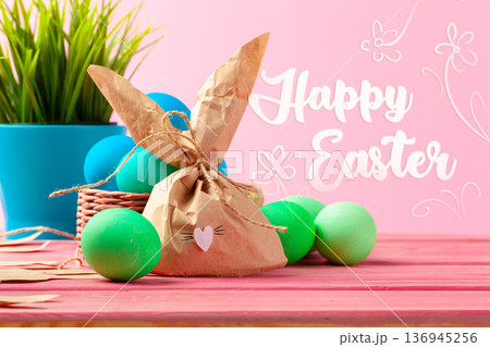 Happy Easter celebration with colorful eggs and bunny decoration on a bright background 136945256