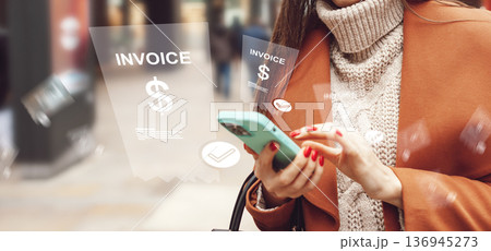 Customer makes banking invoice payment using smartphone in urban setting during daytime Customer makes banking invoice payment using smartphone in urban setting during daytime 136945273
