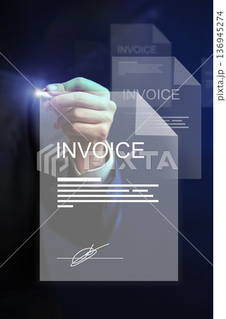 Handwriting on banking invoice for payment in office setting during daytime Handwriting on banking invoice for payment in office setting during daytime 136945274