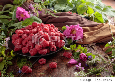 Summer still life with, raspberries, flowers and meadow grasses. Summer still life with, raspberries, flowers and meadow grasses. 136946525