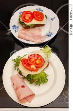 Sandwiches with Ham, Cheese, Tomatoes and Lettuce. 136947288