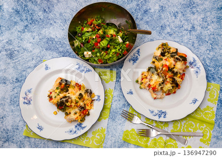 Baked Casserole of Broccoli with Chicken and Vegetables an Salad of Iceberg Lettuce. Baked Casserole of Broccoli with Chicken and Vegetables an Salad of Iceberg Lettuce. 136947290