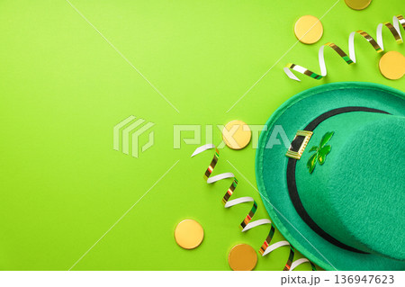 Green background with a leprechaun hat and gold coins 136947623