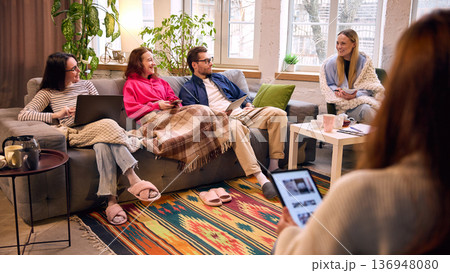 Smiling colleagues brainstorming together in cozy modern office. Smiling colleagues brainstorming together in cozy modern office. 136948080