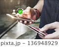 Online security payment concept. Man use smart phone and holding credit card with shopping online. 136948929