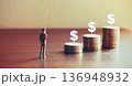 Miniature people looking future with stack coin about financial and money savings concept. 136948932