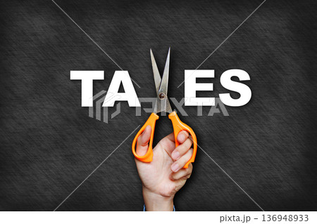 The man's hand holding scissors forms the letter x, creating the word "taxes". 136948933