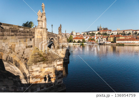 Charles Bridge over Vltava River in Prague with historic statues and Old Town skyline, famous landmark in Czech Republic Charles Bridge over Vltava River in Prague with historic statues and Old Town skyline, famous landmark in Czech Republic 136954759