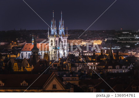 Night cityscape of Prague with illuminated Church of Our Lady before Tyn and historic rooftops in Old Town Czech Republic Night cityscape of Prague with illuminated Church of Our Lady before Tyn and historic rooftops in Old Town Czech Republic 136954761