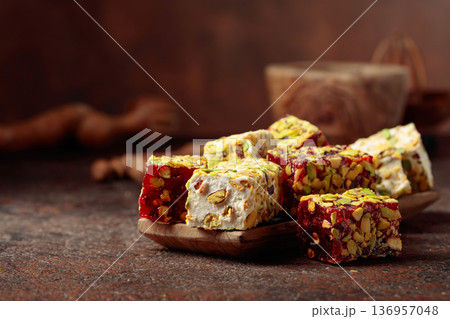 Traditional Turkish delight on an old brown table. 136957048