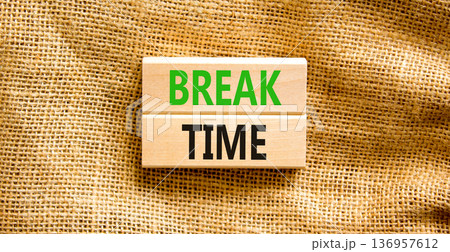 Break time symbol. Concept word Break time on beautiful wooden blocks. Beautiful canvas background. Business break time concept. Copy space. Break time symbol. Concept word Break time on beautiful wooden blocks. Beautiful canvas background. Business break time concept. Copy space. 136957612