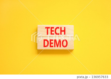 Tech demo symbol. Concept word Tech demo on beautiful wooden blocks. Beautiful yellow paper background. Business tech demo concept. Copy space. Tech demo symbol. Concept word Tech demo on beautiful wooden blocks. Beautiful yellow paper background. Business tech demo concept. Copy space. 136957633