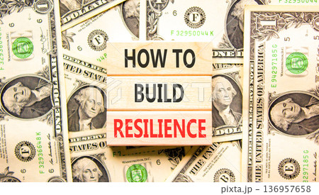 How to build resilience symbol. Concept words How to build resilience on beautiful wooden blocks. Beautiful dollar bills background. Dollar bills. Business how to build resilience concept. Copy space. How to build resilience symbol. Concept words How to build resilience on beautiful wooden blocks. Beautiful dollar bills background. Dollar bills. Business how to build resilience concept. Copy space. 136957658