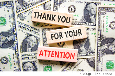 Thank you for your attention symbol. Concept words Thank you for your attention on beautiful wooden blocks. Beautiful dollar bills background. Business thank you for your attention concept. Copy space Thank you for your attention symbol. Concept words Thank you for your attention on beautiful wooden blocks. Beautiful dollar bills background. Business thank you for your attention concept. Copy space 136957688