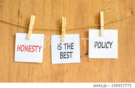 Honesty is the best policy symbol. Concept words Honesty is the best policy on beautiful white papers on clothespin. Beautiful wooden background. Business honesty is the best policy concept Copy space Honesty is the best policy symbol. Concept words Honesty is the best policy on beautiful white papers on clothespin. Beautiful wooden background. Business honesty is the best policy concept Copy space 136957771