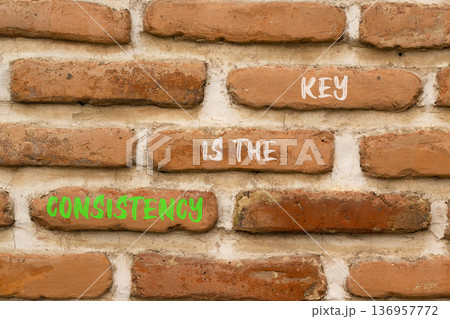 Consistency is the key symbol. Concept words Consistency is the key on beautiful brick wall. Beautiful brick wall background. Business consistency is the key concept. Copy space. Consistency is the key symbol. Concept words Consistency is the key on beautiful brick wall. Beautiful brick wall background. Business consistency is the key concept. Copy space. 136957772