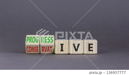 Progressive or conservative symbol. Businessman turns wooden cubes and changes word Conservative to Progressive. Beautiful grey background. Business progressive or conservative concept. Copy space. 136957777