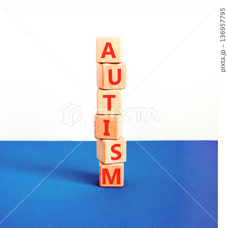 Autism medical symbol. Concept word Autism on beautiful wooden blocks. Beautiful blue and white background. Business autism medical concept. Copy space. 136957795
