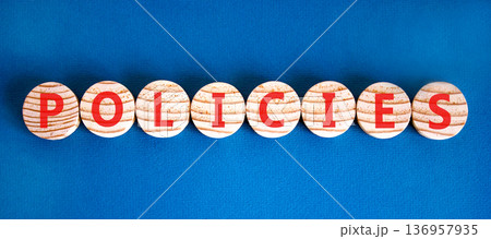 Policies word symbol. Concept word Policies on beautiful wooden circles. Beautiful blue background. Business support help policies word concept. Copy space. 136957935