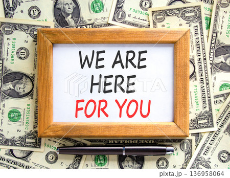 Support, help and we are here for you symbol. Concept words We are here for you on beautiful wooden picture frame. Beautiful dollar bills background. Business we are here for you concept. Copy space. 136958064