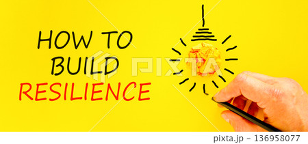 How to build resilience symbol. Concept words How to build resilience on beautiful yellow paper. Beautiful yellow background. Businessman's hand. Business how to build resilience concept. Copy space. 136958077