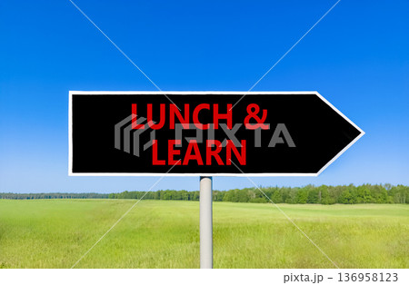 Lunch and learn symbol. Concept words Lunch and learn on beautiful black road sign. Beautiful blue sky green grass field background. Business, educational and lunch and learn concept. Copy space. Lunch and learn symbol. Concept words Lunch and learn on beautiful black road sign. Beautiful blue sky green grass field background. Business, educational and lunch and learn concept. Copy space. 136958123