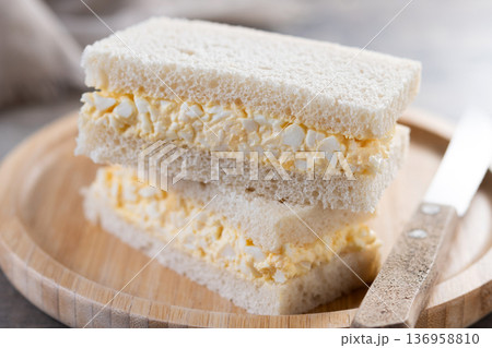 Tamago Sando sandwich on wooden table Tamago Sando sandwich on wooden table 136958810
