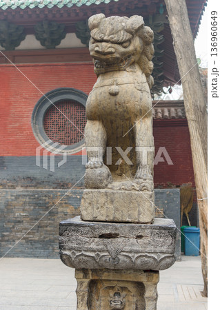 Lion statue at Martial arts Buddhist Shaolin Monastery in Luoyang, China Lion statue at Martial arts Buddhist Shaolin Monastery in Luoyang, China 136960649