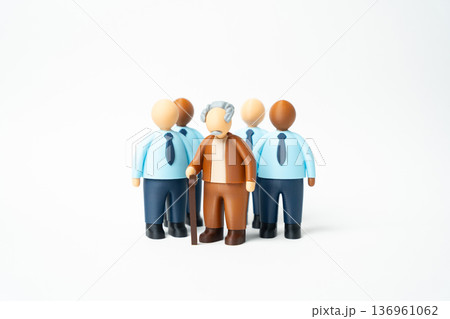 An elderly man surrounded by office workers. A solidarity pension system and dependency ratio challenge. How many employees support one retiree An elderly man surrounded by office workers. A solidarity pension system and dependency ratio challenge. How many employees support one retiree 136961062