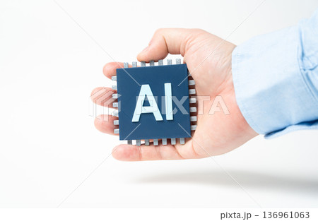 An AI chip in a hand. Breakthrough technologies with artificial intelligence. Digital innovation and smart automation. Future computing and high tech development An AI chip in a hand. Breakthrough technologies with artificial intelligence. Digital innovation and smart automation. Future computing and high tech development 136961063