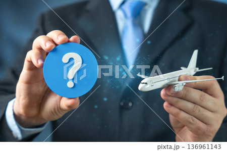 A passenger aircraft and a question mark. FAQ on flights and airport check in preparation. Travel guidance and airline information support. Passenger awareness and trip planning 136961143