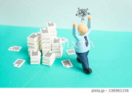 An office worker loses his composure due to the large volume of work. Overload and emotional burnout. Stress management and mental health in corporate environment An office worker loses his composure due to the large volume of work. Overload and emotional burnout. Stress management and mental health in corporate environment 136961156