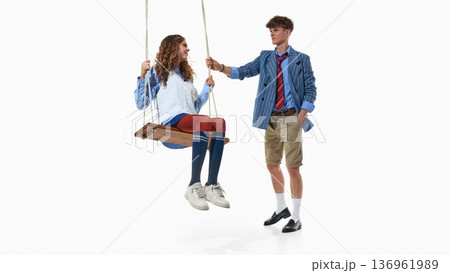 Youth preppy fashion look with swing interaction isolated on white. 136961989