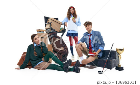 Teenage students in preppy school outfits with golf bag books and trophy isolated on white. Teenage students in preppy school outfits with golf bag books and trophy isolated on white. 136962011