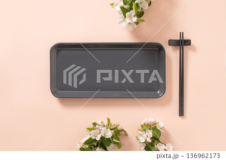 Minimal tray and chopsticks with spring blossom on pastel background Minimal tray and chopsticks with spring blossom on pastel background 136962173