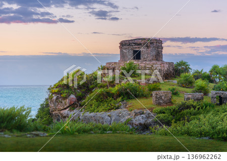Mayan temple at sunset on tulum cliffs overlooking caribbean sea 136962262