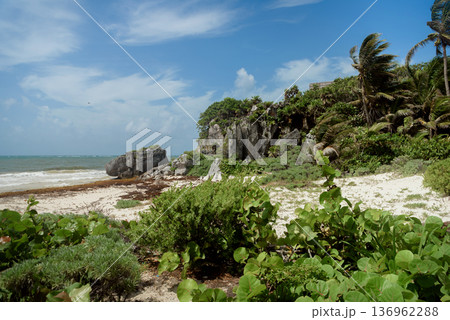 Rocky tulum coastline with mayan ruins overlooking caribbean sea Rocky tulum coastline with mayan ruins overlooking caribbean sea 136962288