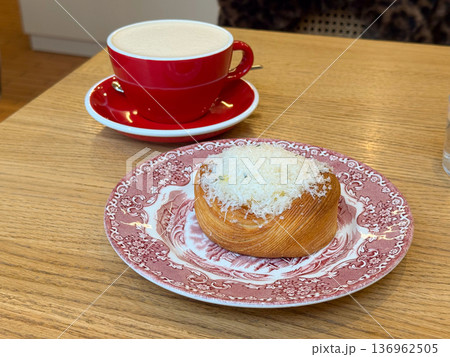 Pastry with cheese on decorative plate and coffee. Breakfast choice, cafe culture, indulgence, culinary tradition, comfort food experience 136962505