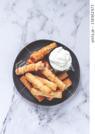 fried spring rolls with cheese, on a plate, with cream sauce, no people, fried spring rolls with cheese, on a plate, with cream sauce, no people, 136962973