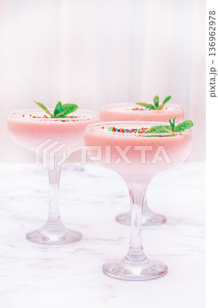 fruit mousse, made from jelly and cottage cheese, in glasses, decorated with sprinkles and mint, homemade 136962978