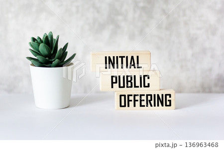 The conceptual word "Initial Public Offering" on wooden blocks. Beautiful light background. 136963468