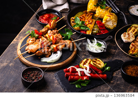 Assortment of grilled bbq meat and vegetables 136963584