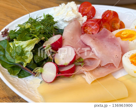 Fresh salad with ham and cheese on breakfast plate. Balanced nutrition, organic ingredient and brunch cuisine concept. Fresh salad with ham and cheese on breakfast plate. Balanced nutrition, organic ingredient and brunch cuisine concept. 136963900