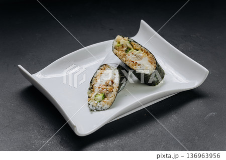 Temaki sushi hand roll with chicken rice and cream cheese served on white plate Temaki sushi hand roll with chicken rice and cream cheese served on white plate 136963956